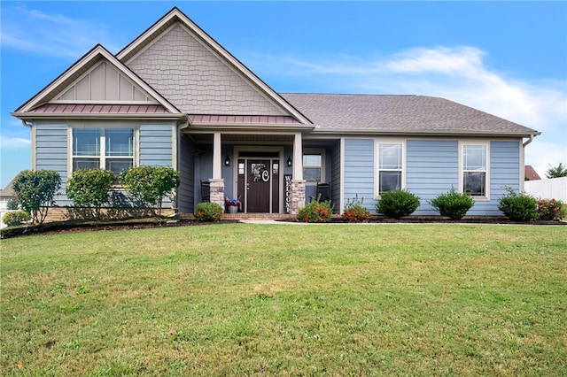 craftsman-style home with a front yard