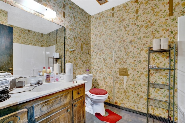 bathroom featuring vanity and toilet