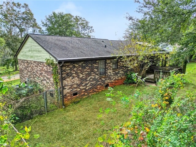 view of property exterior with a yard