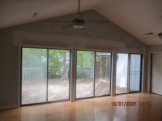 interior space with vaulted ceiling and ceiling fan