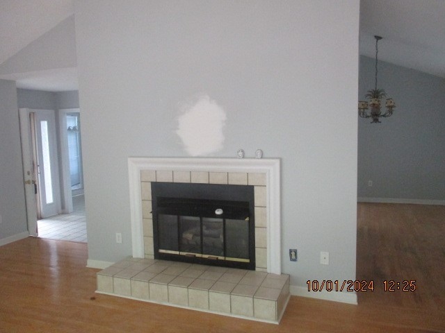 interior details featuring a fireplace and hardwood / wood-style floors