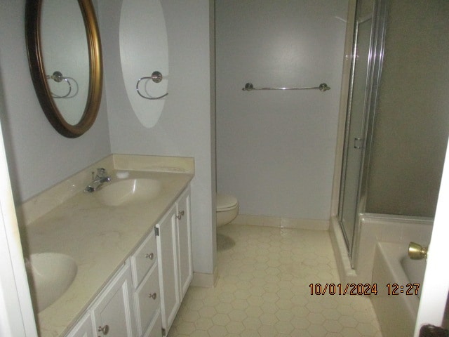 full bathroom with tile patterned floors, toilet, vanity, and shower with separate bathtub