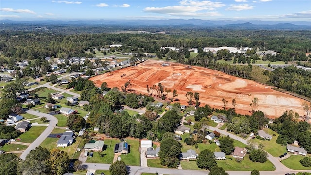 birds eye view of property featuring a mountain view