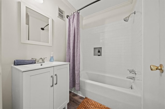 bathroom with hardwood / wood-style floors, crown molding, vanity, and shower / bath combo