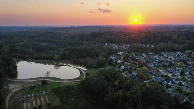 aerial view at dusk with a water view