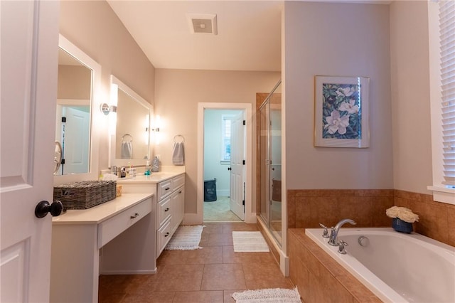 bathroom featuring vanity, separate shower and tub, and tile patterned floors