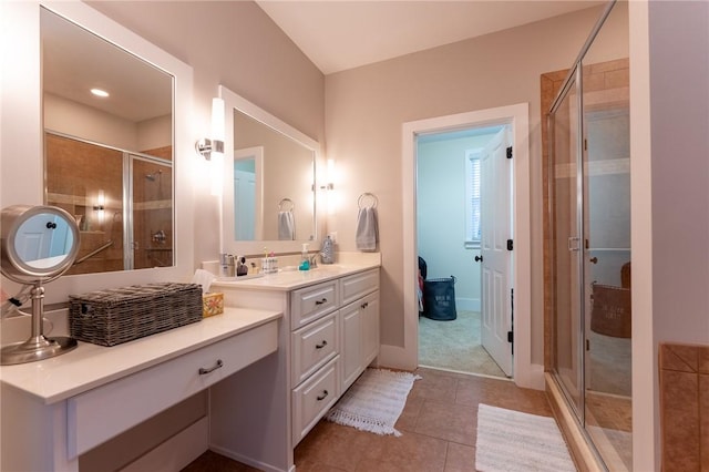 bathroom with vanity, tile patterned floors, and a shower with shower door