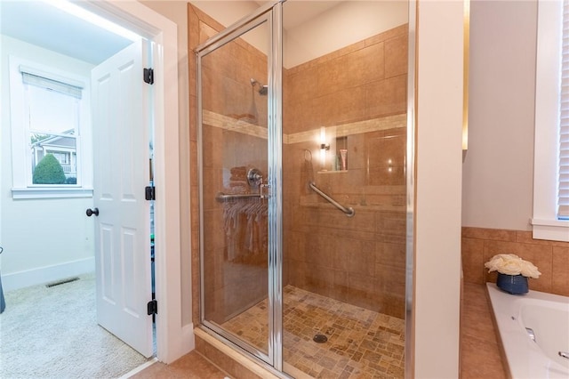 bathroom with plus walk in shower and tile patterned floors