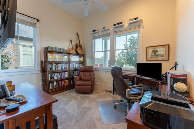 carpeted home office with ceiling fan