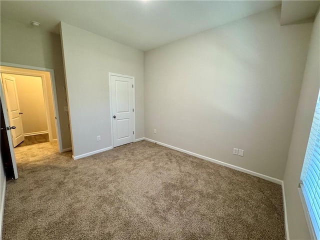 unfurnished bedroom with carpet flooring