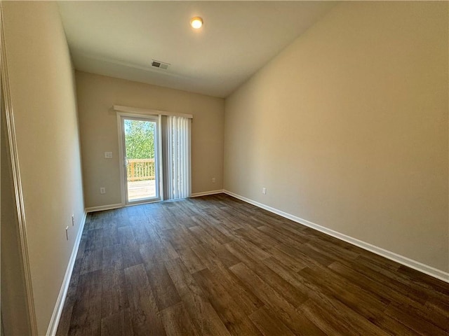 unfurnished room featuring dark hardwood / wood-style floors