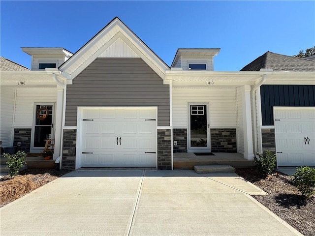 view of front of home featuring a garage and a porch