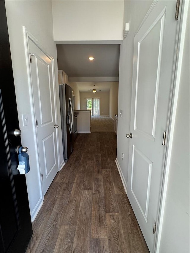 hall featuring wooden walls