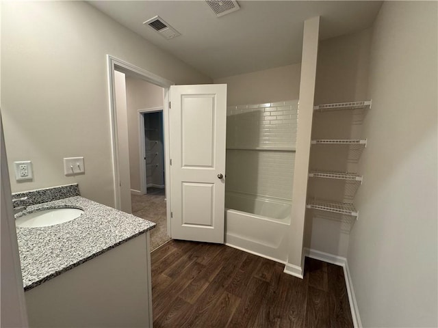 bathroom featuring wood-type flooring and vanity