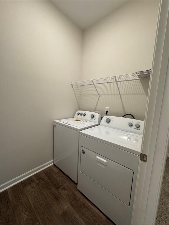 washroom featuring stacked washer / dryer