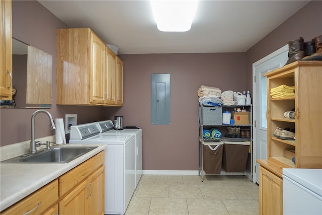 laundry room with washer and clothes dryer, cabinets, electric panel, sink, and light tile patterned floors