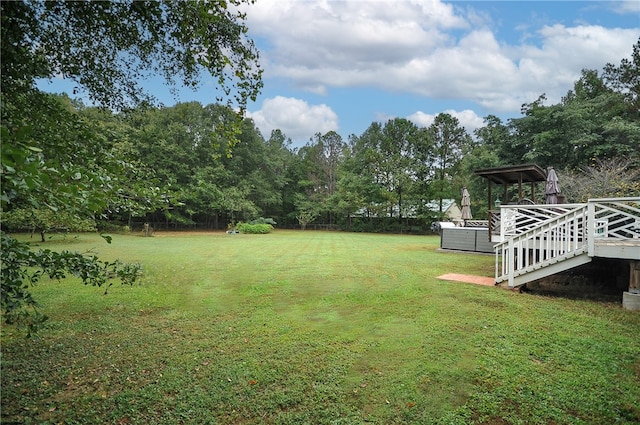 view of yard with a wooden deck