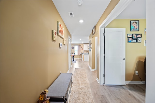 hallway featuring light hardwood / wood-style flooring