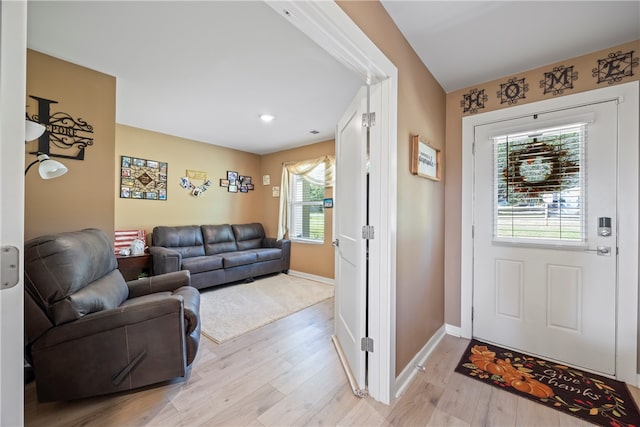 foyer entrance with light wood-type flooring