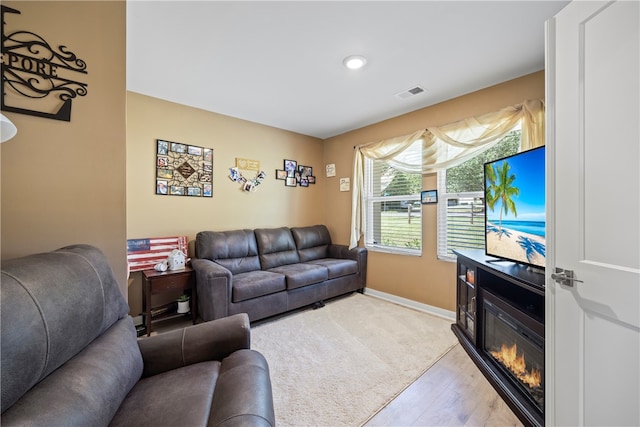 living room with light hardwood / wood-style floors