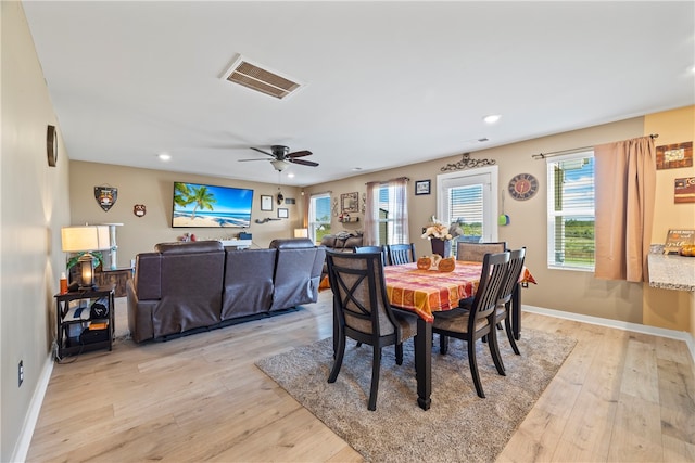 dining space featuring ceiling fan and light hardwood / wood-style floors