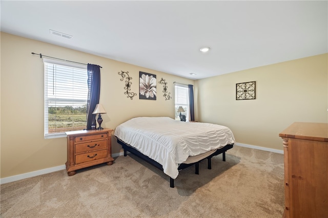 bedroom with light carpet