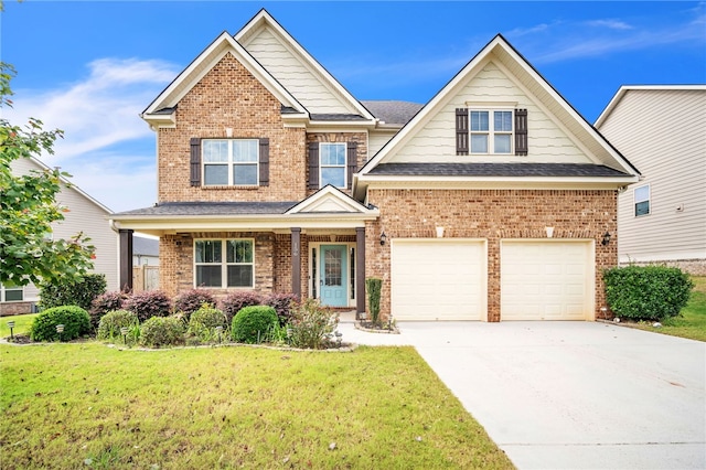 craftsman-style house with a garage, concrete driveway, brick siding, and a front lawn