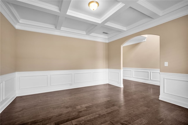 unfurnished room with dark wood-style floors, arched walkways, beam ceiling, visible vents, and coffered ceiling