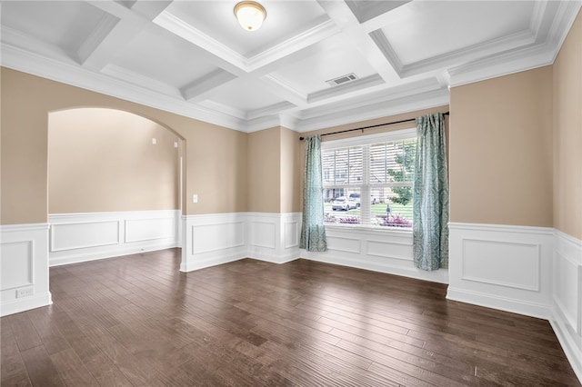 unfurnished room featuring dark wood-style floors, arched walkways, visible vents, and beamed ceiling