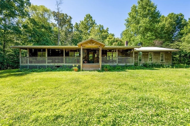 exterior space with a porch and a front yard