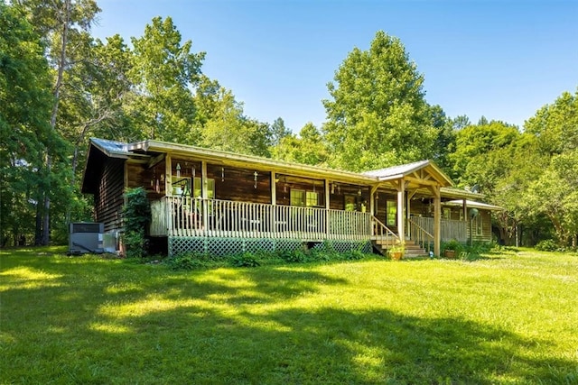 log-style house with a front yard