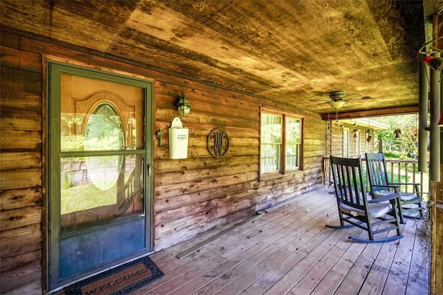 property entrance featuring a porch and ceiling fan