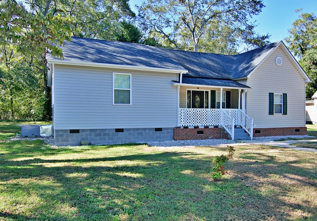 view of side of home with a yard