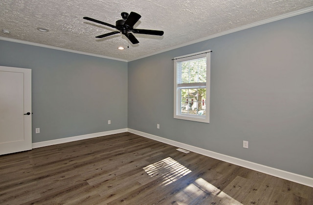 empty room featuring ornamental molding, ceiling fan, and dark wood-type flooring