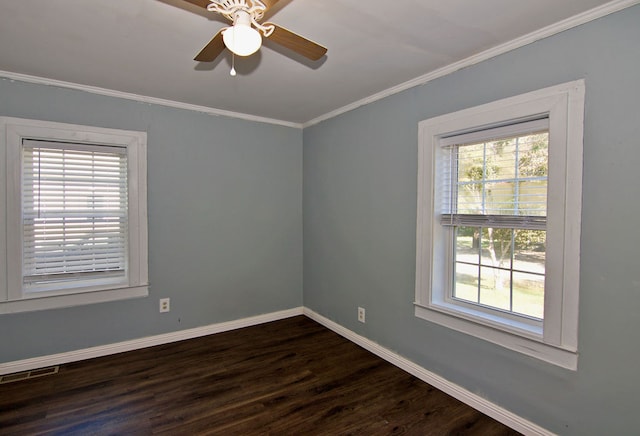 empty room featuring ceiling fan, crown molding, and dark wood-type flooring