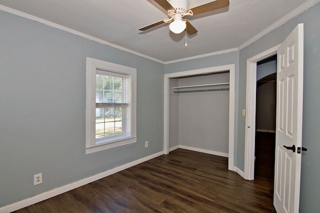 unfurnished bedroom with ceiling fan, ornamental molding, a closet, and dark wood-type flooring