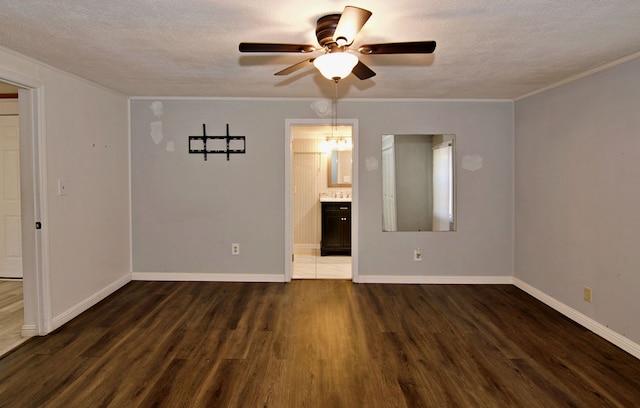 unfurnished room featuring ceiling fan, dark hardwood / wood-style floors, and a textured ceiling