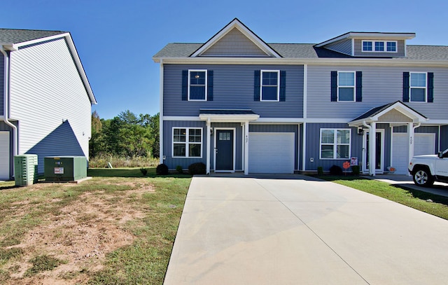 view of front facade with a front yard and a garage