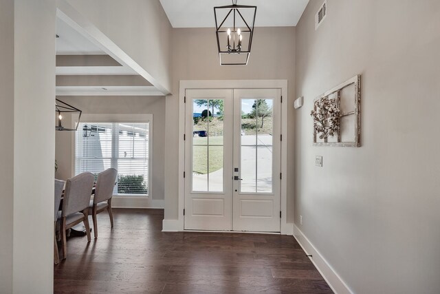 doorway to outside featuring french doors, an inviting chandelier, and dark hardwood / wood-style flooring