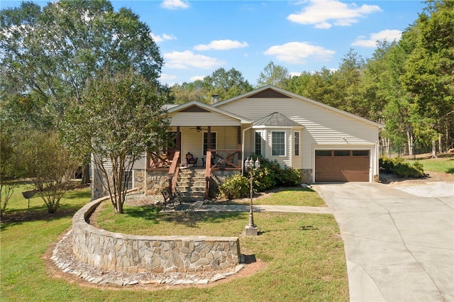 view of front of property with a porch, a garage, and a front lawn