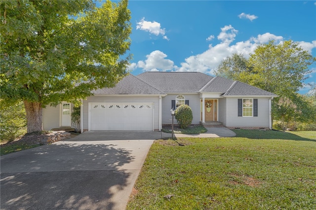 ranch-style home with a front yard and a garage