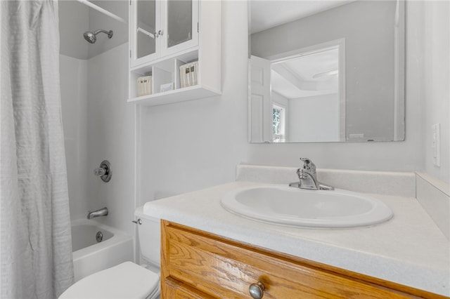 full bathroom featuring vanity, shower / bath combo, and toilet