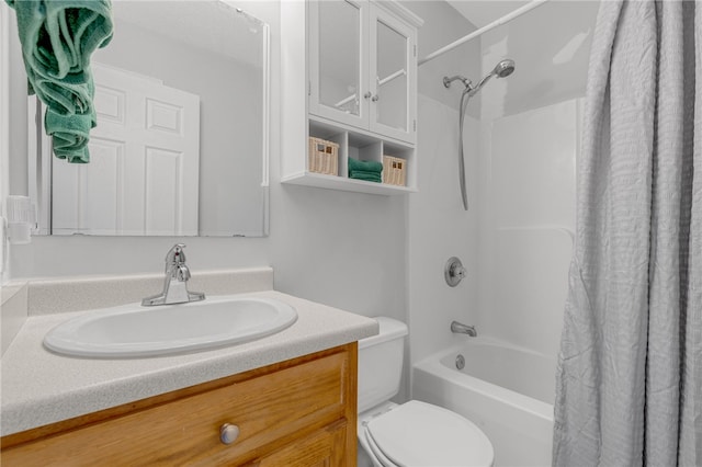 full bathroom featuring vanity, shower / bath combo, and toilet