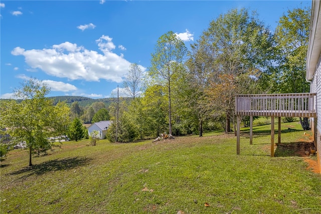 view of yard with a wooden deck