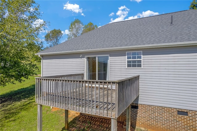 wooden deck featuring a yard