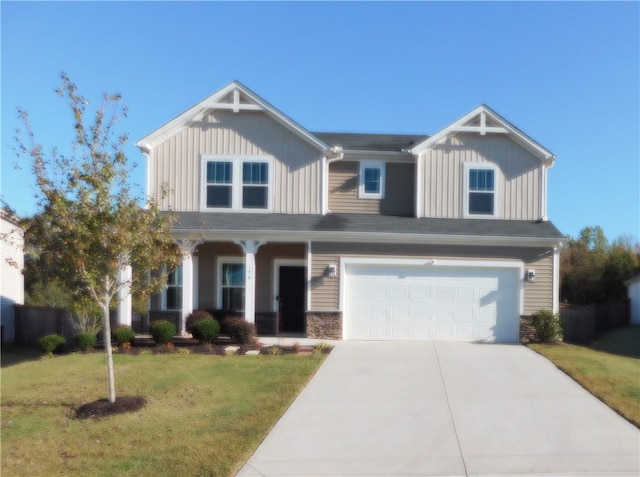 view of front of house with a garage and a front yard