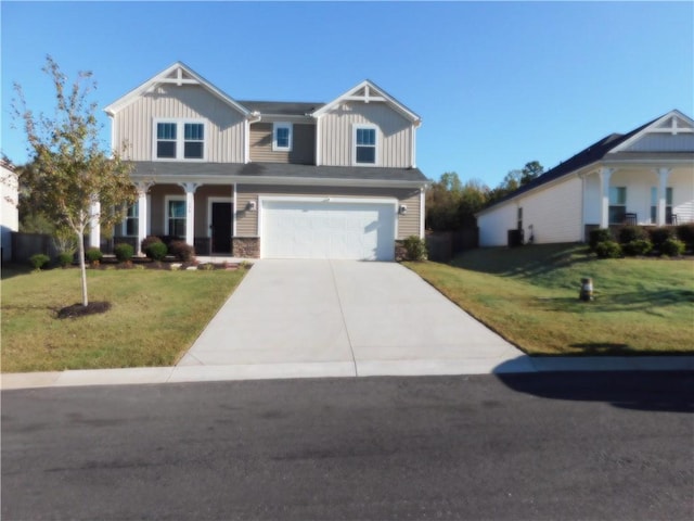 view of front facade featuring a front yard and a garage