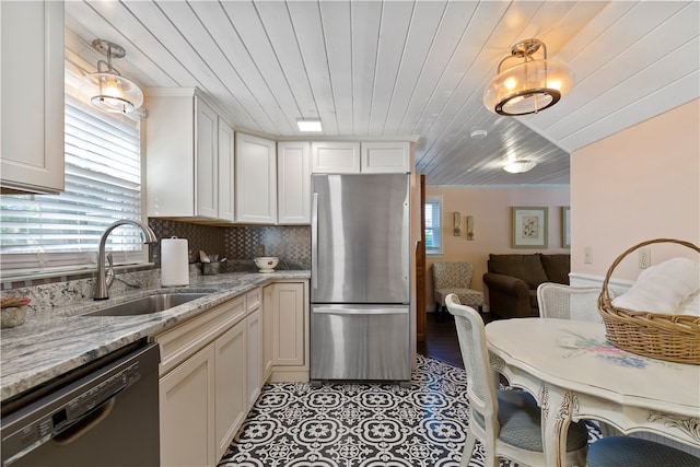 kitchen with wooden ceiling, a sink, freestanding refrigerator, decorative backsplash, and dishwasher