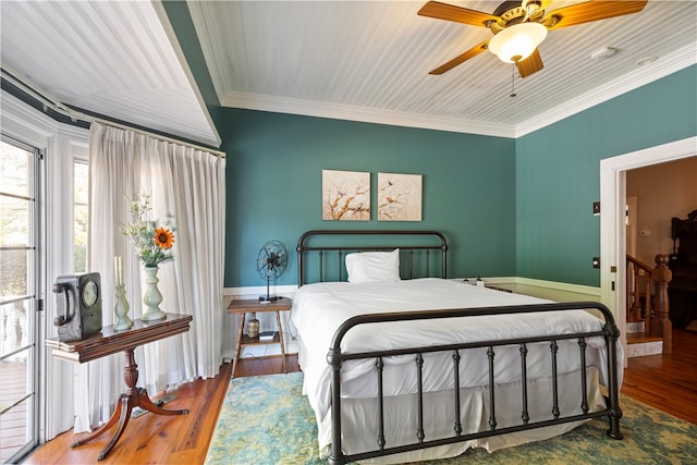 bedroom with ceiling fan, ornamental molding, and wood finished floors