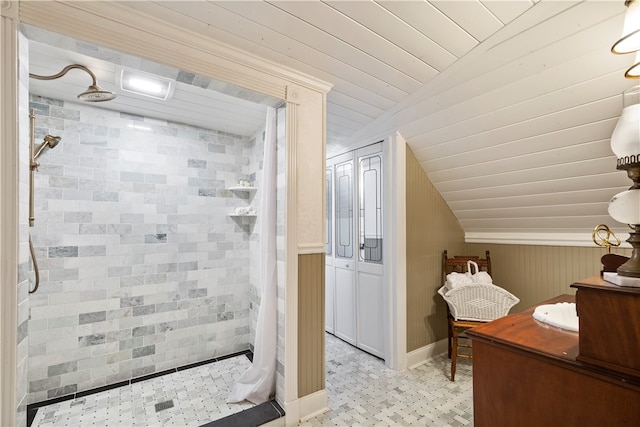 bathroom featuring lofted ceiling, a stall shower, wooden ceiling, and vanity